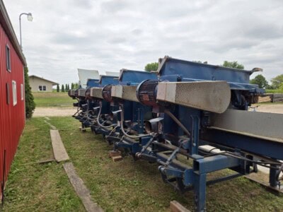 Blue Brewco 5-Head dairy milking equipment with visible components and condition.