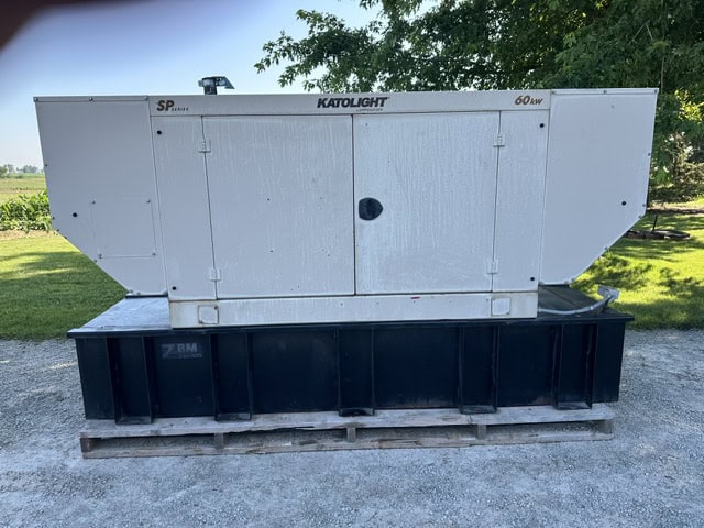 60 kW John Deere Katolight generator with white housing and black base on wooden pallet.