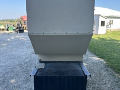 KATOLIGHT generator unit with gray metal housing and black base on gravel surface.