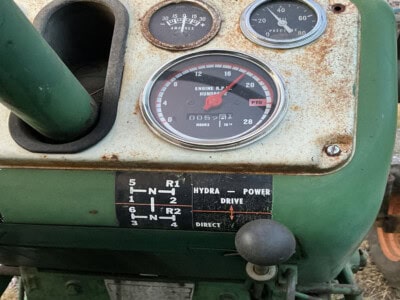 Close-up of Oliver 1550 tractor dashboard with gauges and controls.