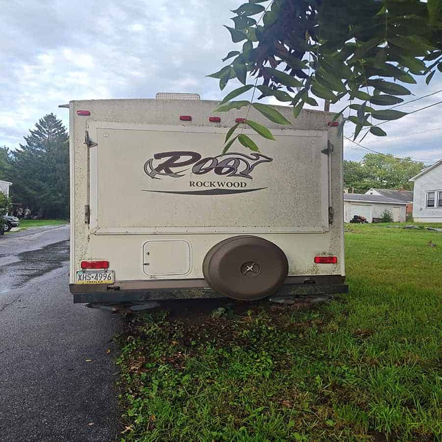 1000004552c (1) Rockwood Roo 19 camper trailer rear view with spare tire and license plate.