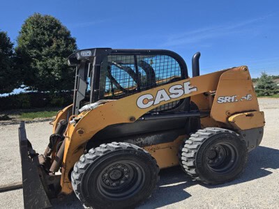 2020 CASE SR175B skid steer loader with enclosed cab and bucket attachment on gravel surface.