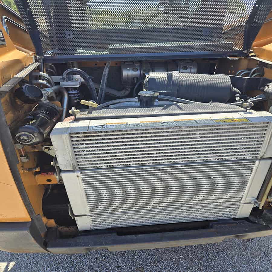 2020 CASE SR175B Skid Steer Loader Engine Engine compartment of a 2020 CASE SR175B skid steer loader showing radiator and engine components.