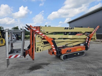 2015 JLG X700AJ articulating boom lift with extended boom and platform, tracked undercarriage, outdoor setting.