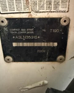 Compact skid steer track loader model T190 from 2000 with visible serial number A3LN35315.