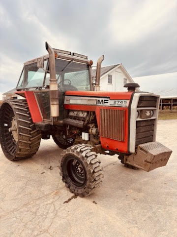 4 Massey Ferguson 2745 tractor with enclosed cab and front weight block.
