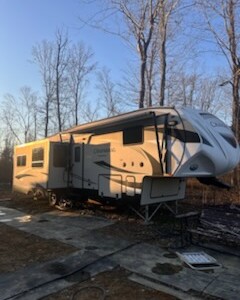 2022 Keystone Montana 3761FL fifth wheel RV with front living area and large slide-outs.