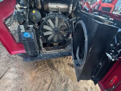 Close-up of engine compartment on 2024 YANMAR TL100VS compact track loader showing radiator and cooling system.