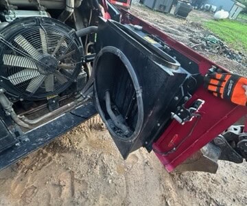 Yanmar TL100VS compact tractor with front loader attachment and visible engine components.