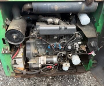 Close-up of 2005 Bobcat T190 compact track loader engine with visible components and hoses.