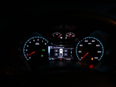 Car dashboard displaying tire pressure, speedometer, and fuel gauge in a Chevrolet vehicle.