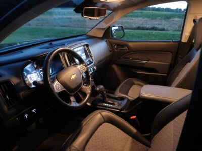 Interior view of a 2018 Chevrolet Colorado Z71 showing dashboard and front seats.