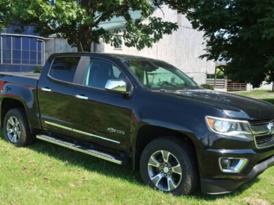 2018 Chevrolet Colorado Z71 black pickup truck with crew cab and off-road features.