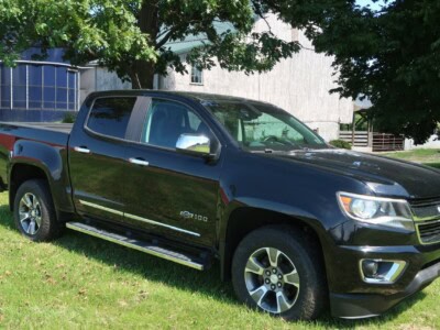 2018 Chevrolet Colorado Z71 black pickup truck with crew cab and off-road features.