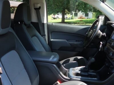 Interior view of a 2018 Chevrolet Colorado Z71 showing front seats and dashboard.