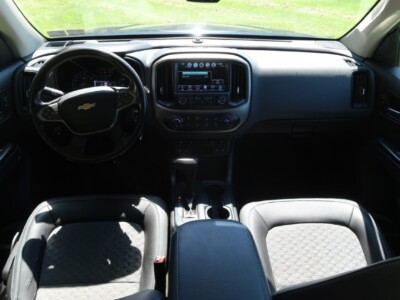 Interior view of a 2018 Chevrolet Colorado Z71 showing dashboard and seats.