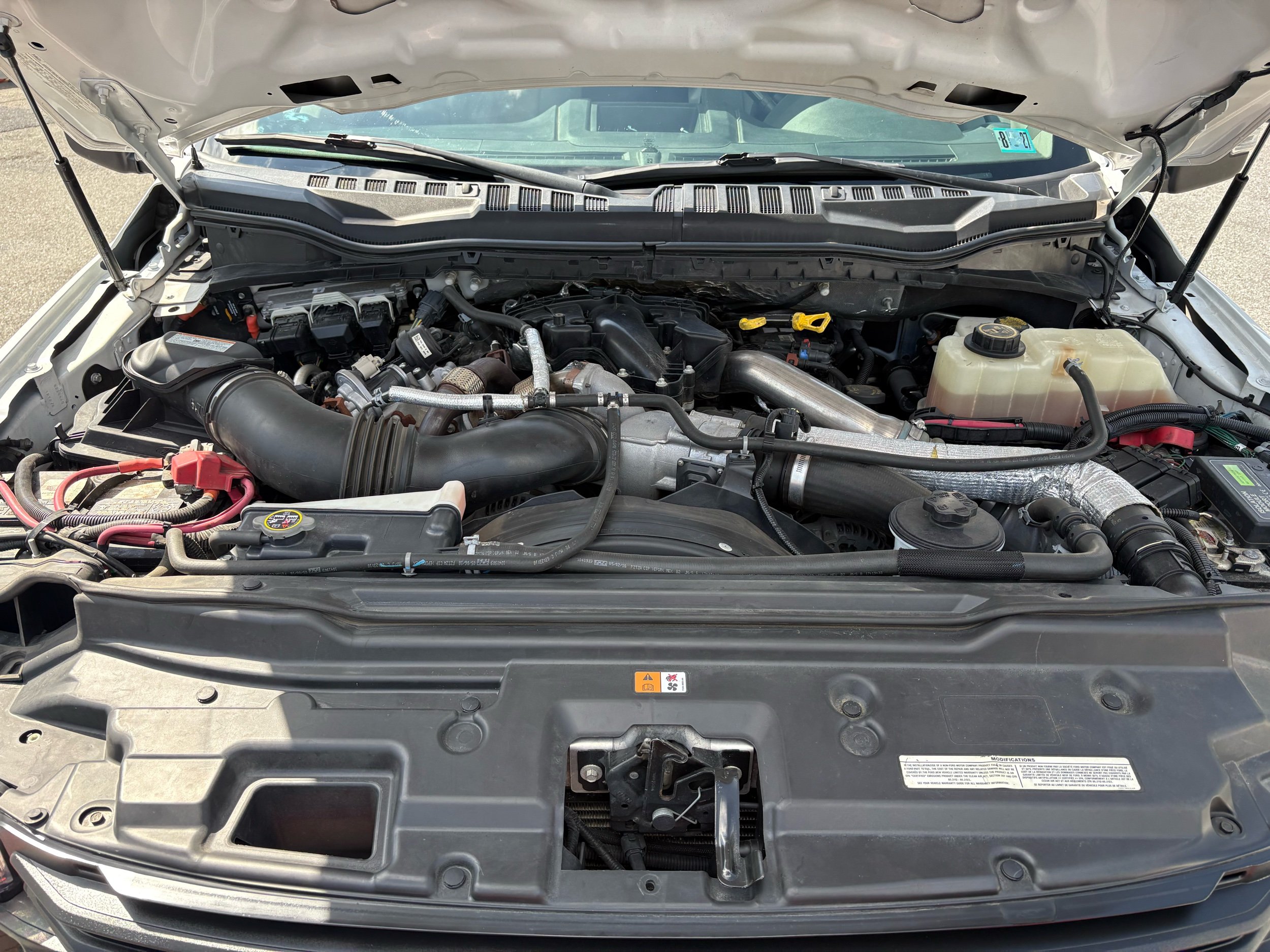 10946 - 2018 Ford F-550 Chassis - 022 2018 Ford F-550 Super Duty XL engine bay with visible components and hoses.