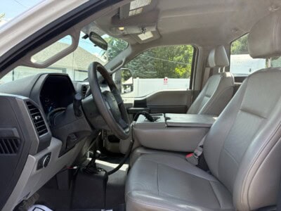 2018 Ford F-550 Super Duty XL interior with gray leather seats and dashboard.