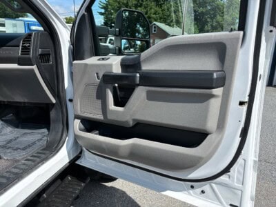 Close-up of the driver's side door interior of a 2018 Ford F-550 Super Duty XL.