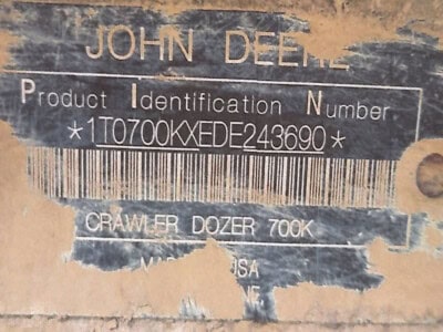 John Deere crawler dozer 700K product ID plate with serial number and model details.