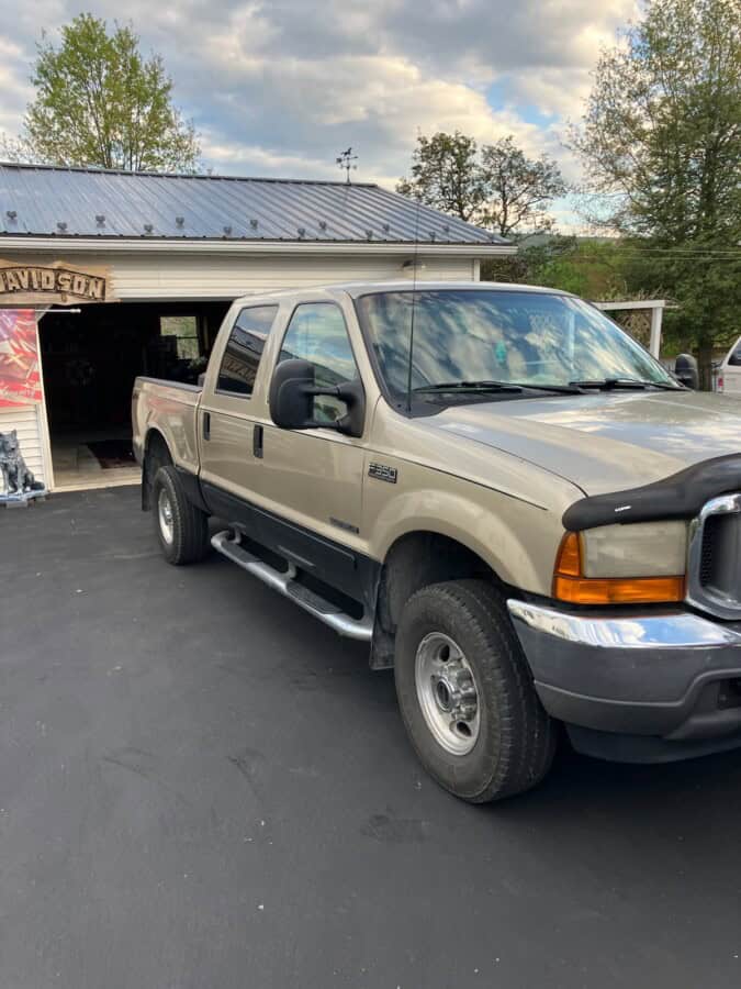 2008 Ford F-250 Super Duty pickup truck with extended cab and dual rear wheels.