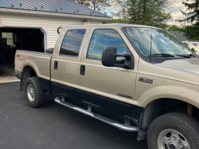 2004 Ford F-350 Super Duty pickup truck with extended cab and dual rear wheels.