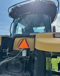 2013 Challenger MT855C tractor with enclosed cab and visible controls.