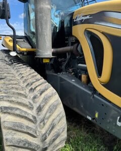 2013 Challenger MT855C agricultural tractor with large rear tire and enclosed cab.