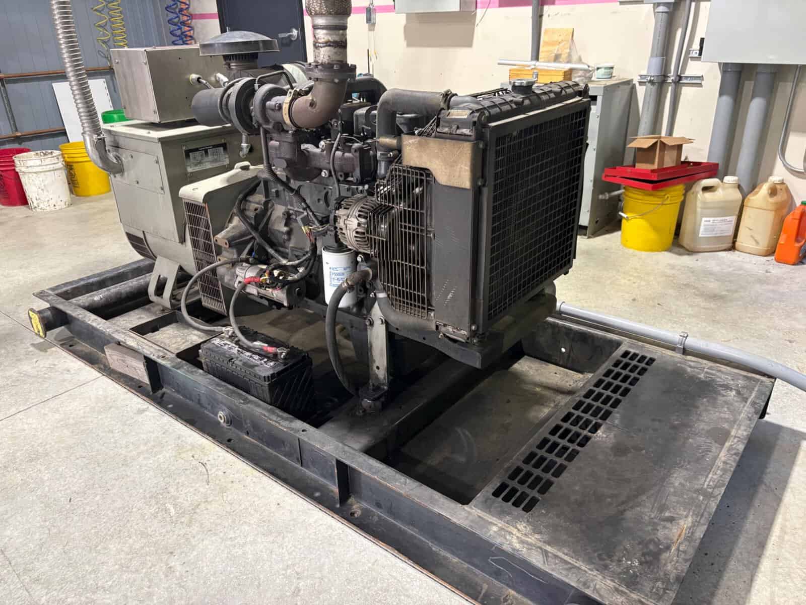 60 kW Diesel Generator Set for Industrial Use Industrial 60 kW diesel generator with radiator and control panel.