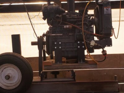 Morgan single head resaw with motor and control panel on a mobile stand.