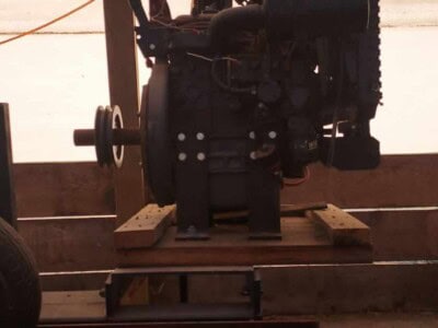 Single head resaw machine with motor and adjustable blade for wood cutting.