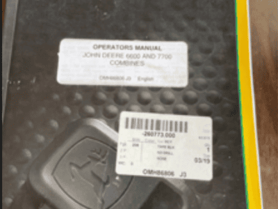 John Deere 6600 operator's manual with barcode and manual label visible.