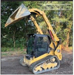 2021 CAT 259D3 compact track loader with bucket attachment and enclosed cab.