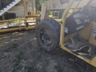 2006 Pettibone T8044 telehandler with extended boom and large tires.