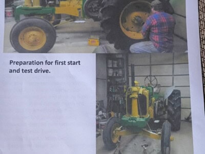 John Deere tractor being prepared for first start and test drive in a workshop.