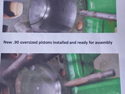 New .90 oversized pistons installed for engine assembly, shown with cylinder bores and connecting rods.