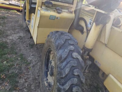 2006 Pettibone T8044 telehandler with large tires and enclosed cab.