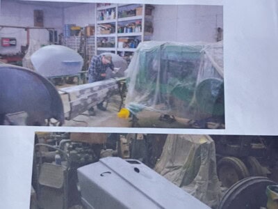 Metal fabrication equipment including tanks and machinery in workshop setting.