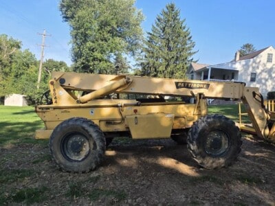 2006 Pettibone T8044 telehandler with extended boom and large tires.