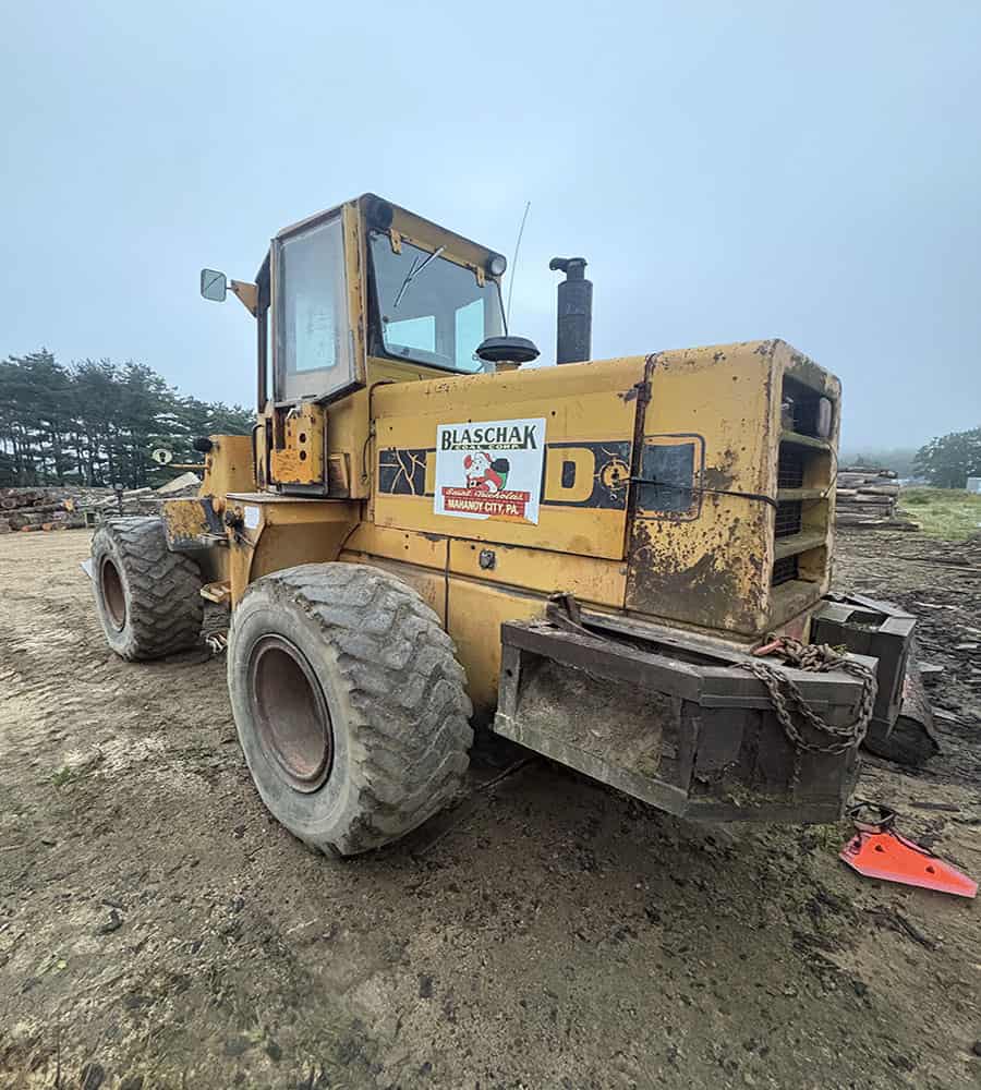 Ford A64 Wheel Loader for Construction Use Yellow Ford A64 wheel loader with large tires and enclosed cab on construction site.