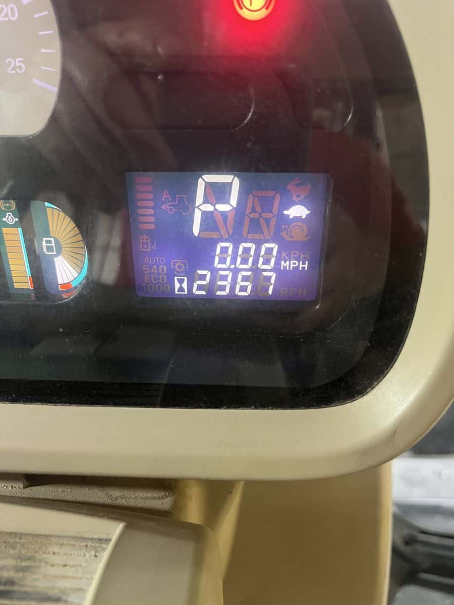 Massey Ferguson 7624 Dashboard Display Digital dashboard of Massey Ferguson 7624 tractor showing speed, fuel, and warning lights.