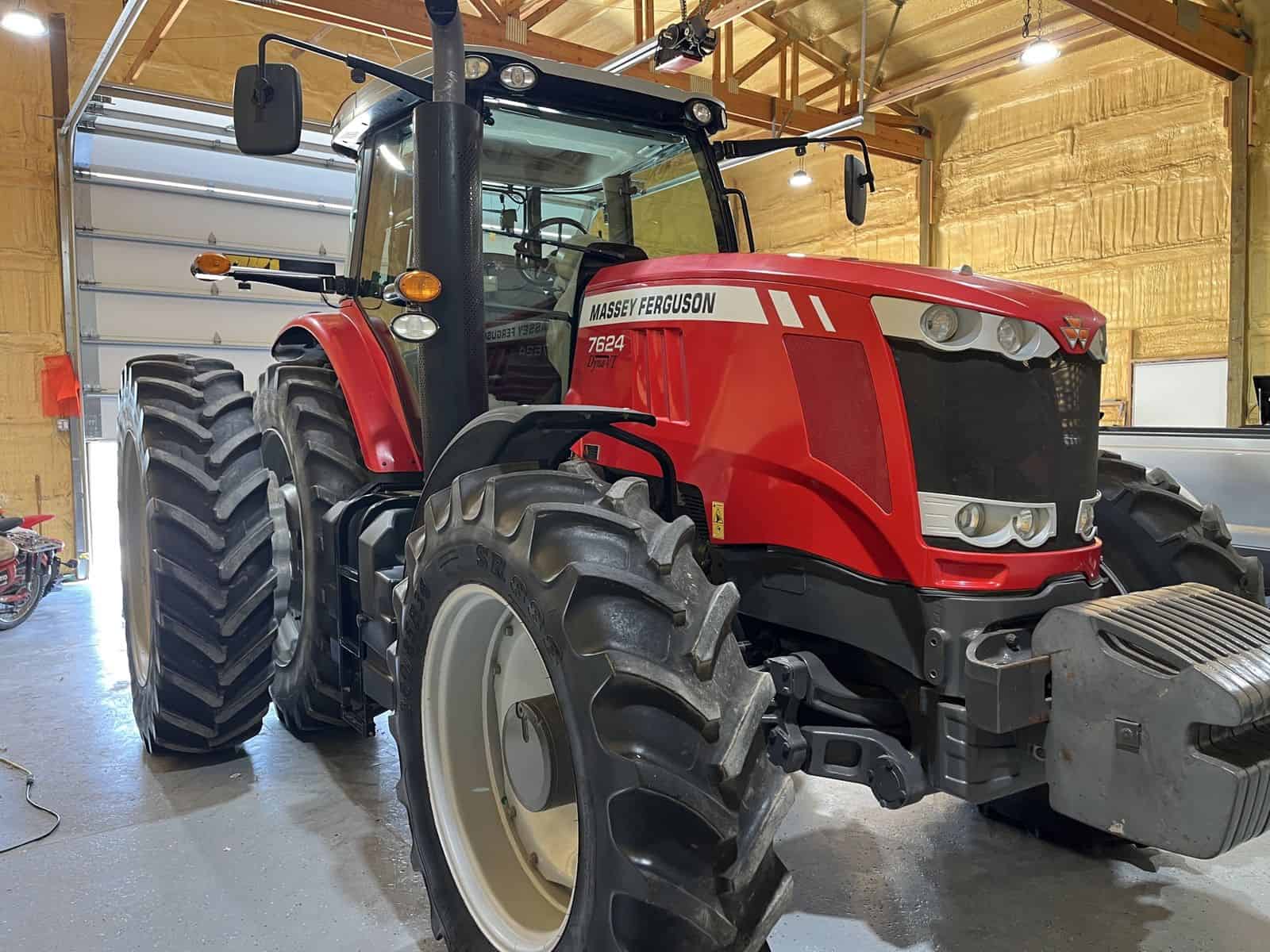 2012 Massey Ferguson 7624 Tractor 2012 Massey Ferguson 7624 tractor with cab and large tires in barn.