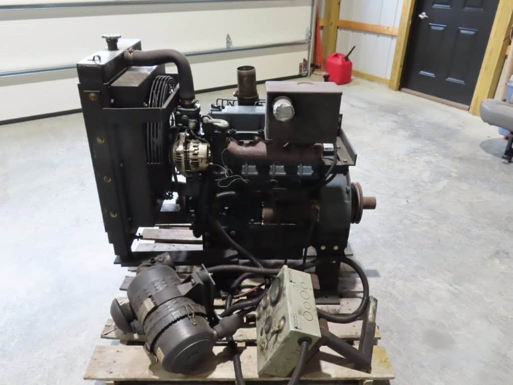 2013 Kubota V3300-BG-ET01 Power Unit 2013 Kubota V3300-BG-ET01 diesel engine with radiator and controls in garage.