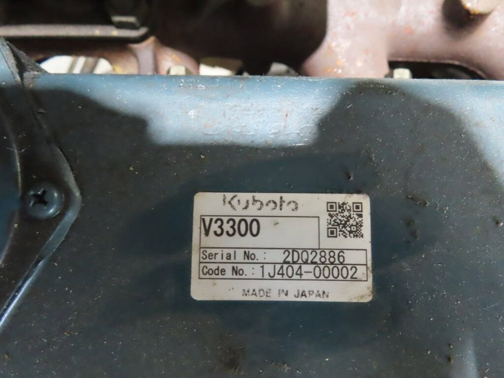 Kubota V3300-BG-ET01 Power Unit Serial Label Serial label on Kubota V3300-BG-ET01 power unit showing model and serial number.