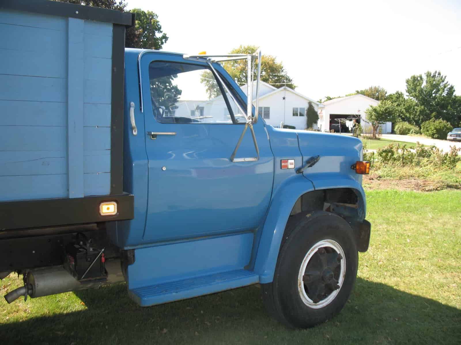 1985 GMC C7000 Grain Truck Front Half 1985 GMC C7000 grain truck blue cab and dump bed.
