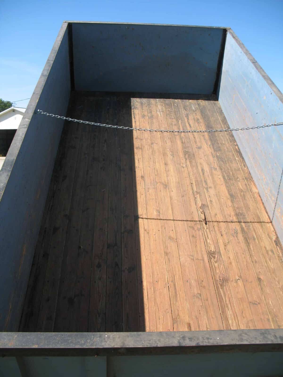 GMC C7000 Utility Trailer Bed 1985 1985 GMC C7000 truck bed trailer with wooden floor and chain.