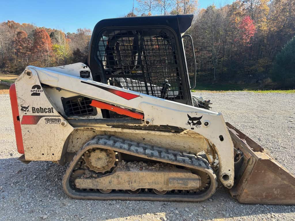 2017 Bobcat T450 compact track loader with bucket and enclosed cab.