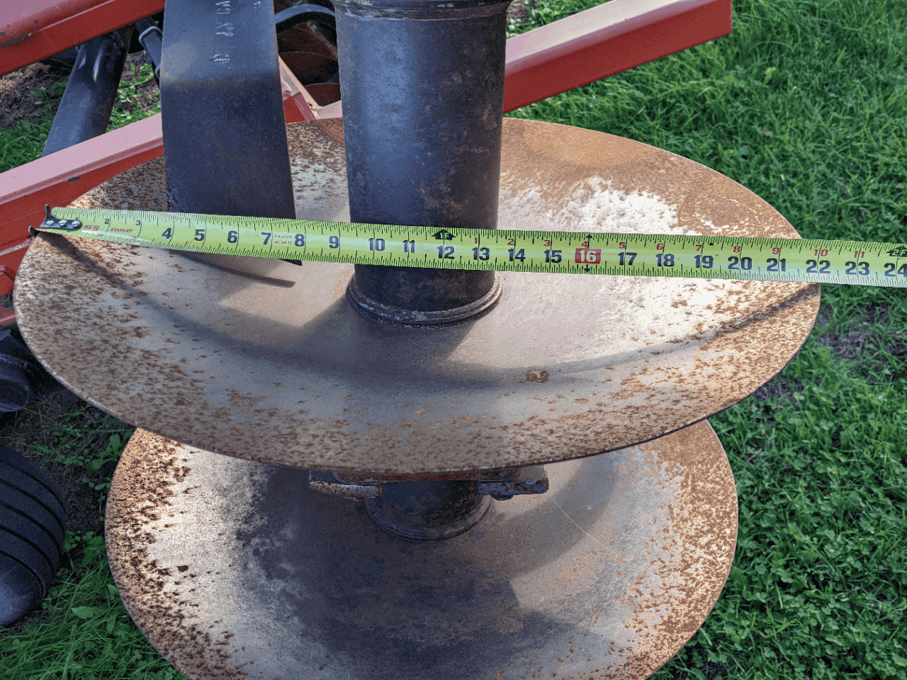 TD500 equipment auger wheel assembly Versatile TD500 auger wheel assembly with measurement tape.
