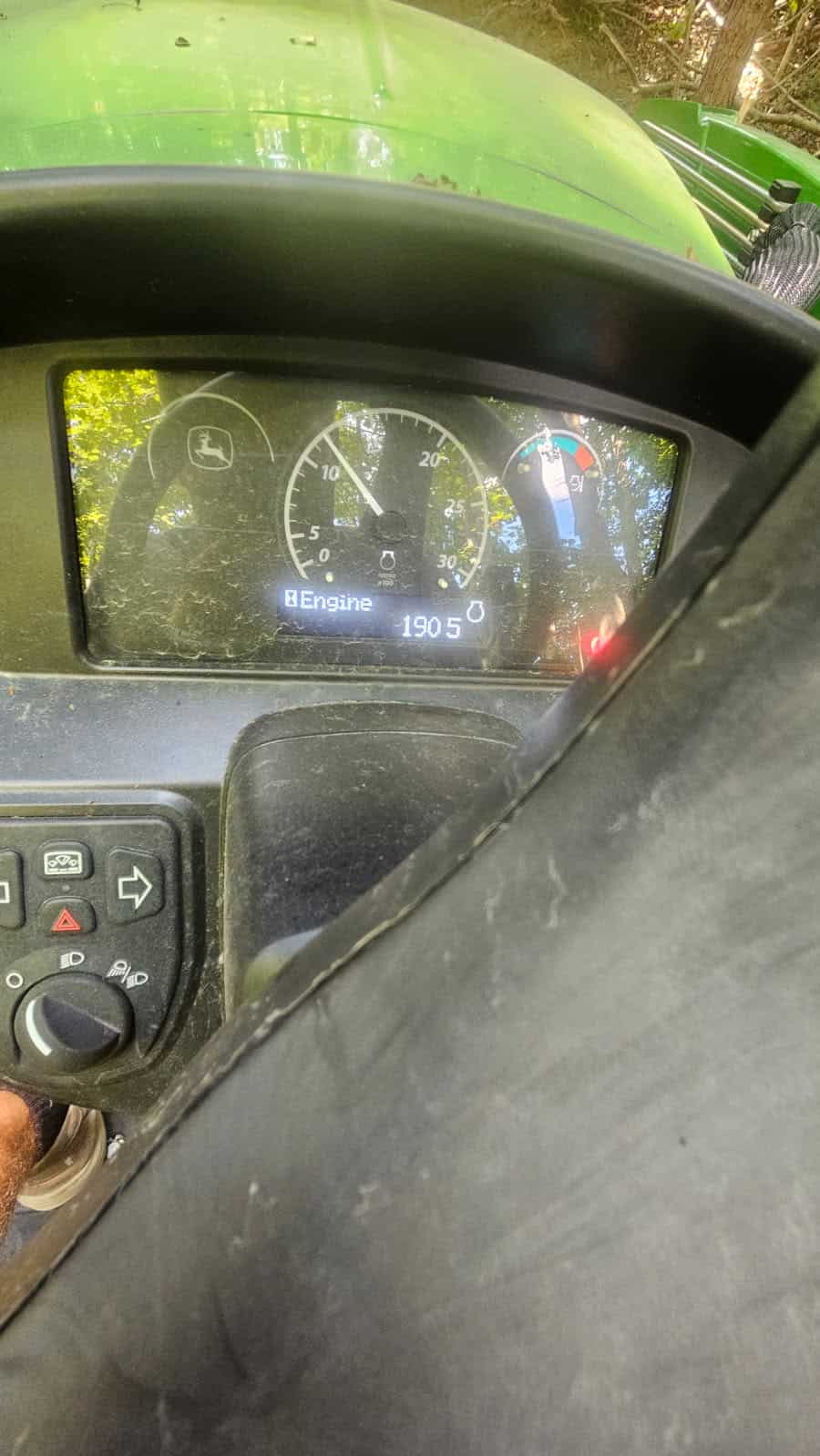 image000001 (10) John Deere 3025E dashboard showing engine temperature and fuel gauge.