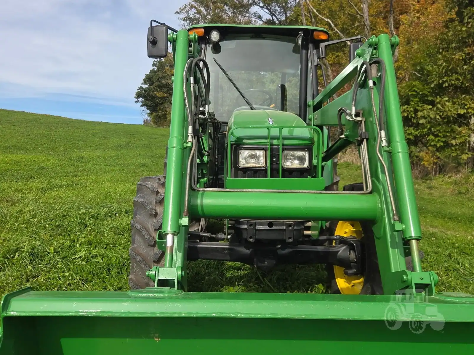 img (13) 2010 John Deere 5101E compact utility tractor with front loader attachment on grassy field.